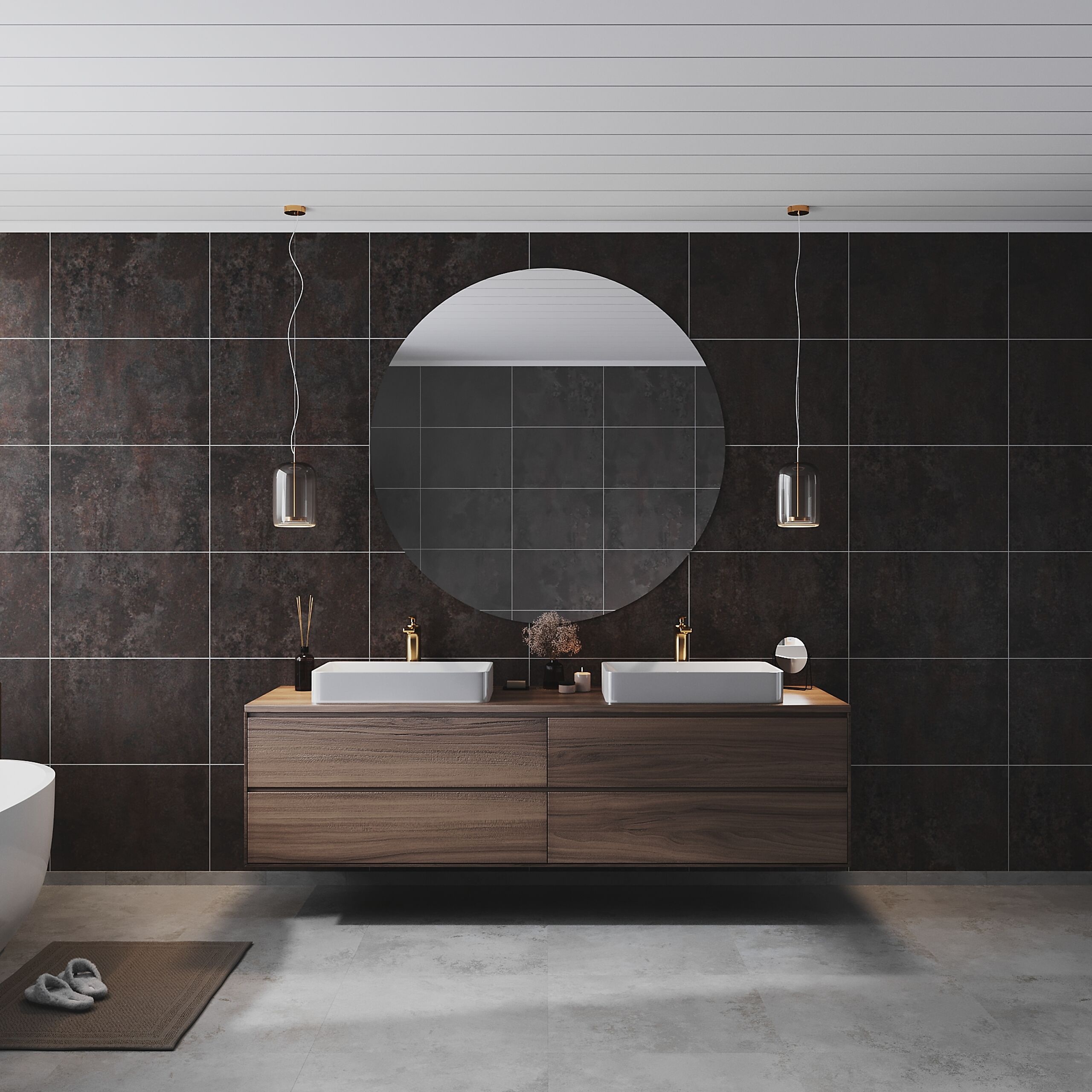 Ett stilrent badrum med ett stort runt spegel ovanför en dubbelsink med modern design. Väggarna är klädda med mörka plattor, och det finns hängande lampor i metall. Golvet är i ljus betong.